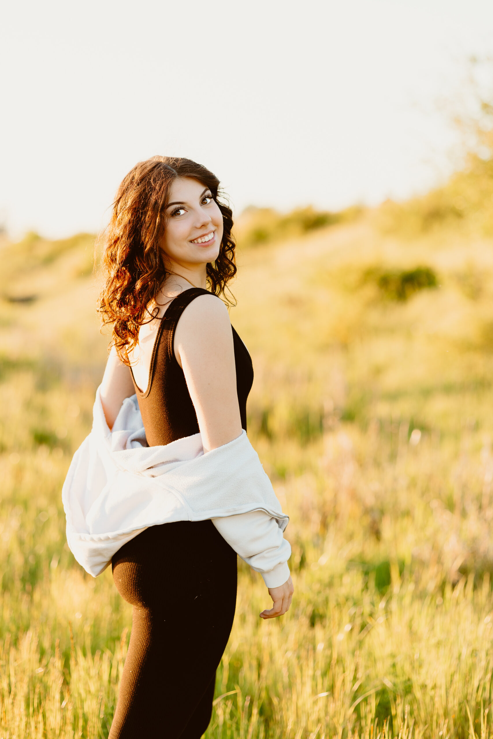 high school senior in field of grass